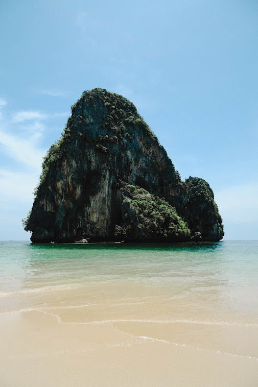 limeston cliff standing still in the sea krabi